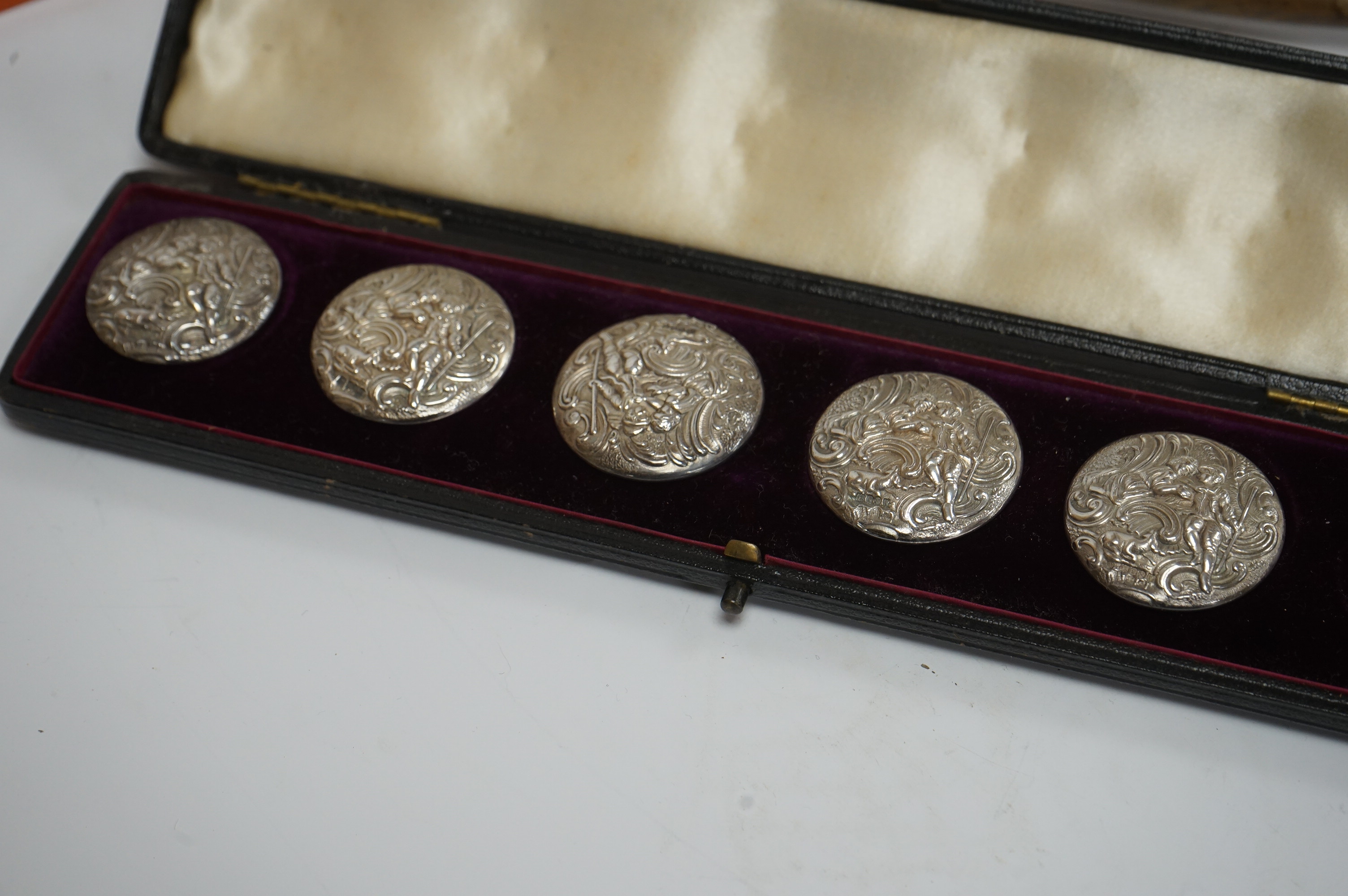 A cased set of five(ex 6) Edwardian repousse silver buttons, import marks for London, 1902, 33mm, a modern wooden handled silver extinguisher, six assorted Victorian and later silver mounted glass toilet jars and a cased